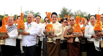 Crowds Join Wax Castle Procession at That Luang Festival in Vientiane